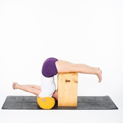 Yogikuti Halasana Box B Yoga Bench providing support & balance in Halasana Pose