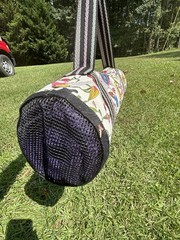 Sakroots Peace Yoga Exercise Mat Tote Duffle Bag Over Shoulder With A Purple Mat