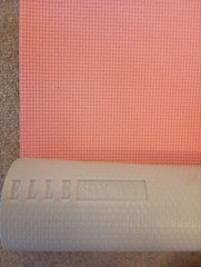 ELLE Sport branded yoga mat for sale. Has a visible logo ELLE Sport on the side.