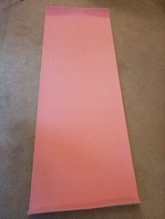 ELLE Sport branded yoga mat for sale. Has a visible logo ELLE Sport on the side.