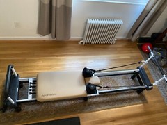 AeroPilates reformer with stand, rebounder, and instructional CDs